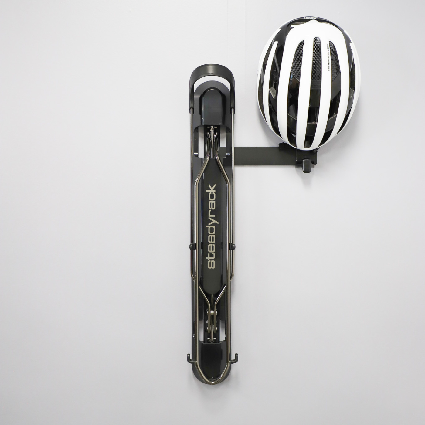 A ProFlex Rack with a bracket holding a helmet hook. The helmet hook is storing a white helmet. 